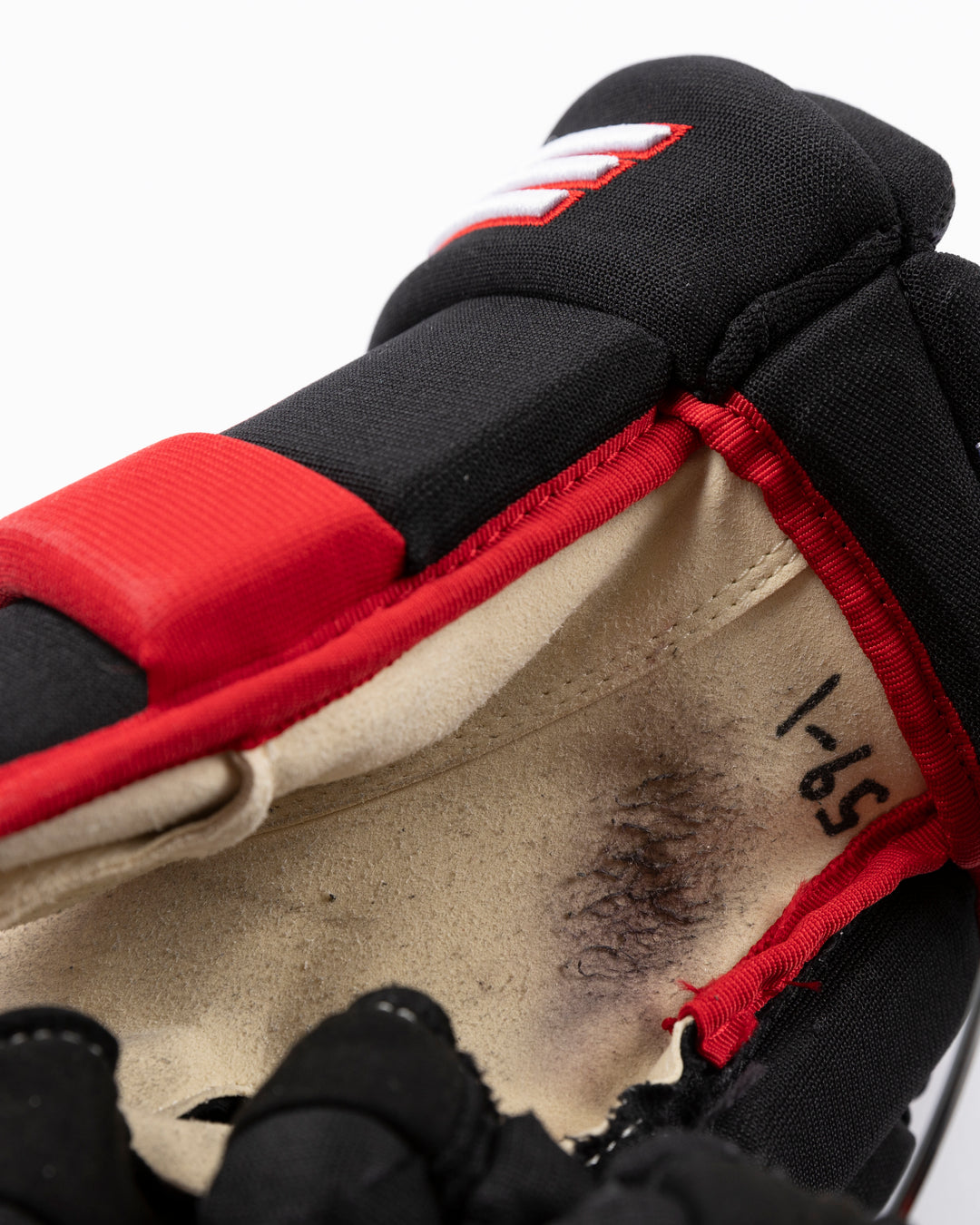 black TRUE brand hockey gloves used by Chicago Blackhawks player Tyler Bertuzzi - alt detail lay flat