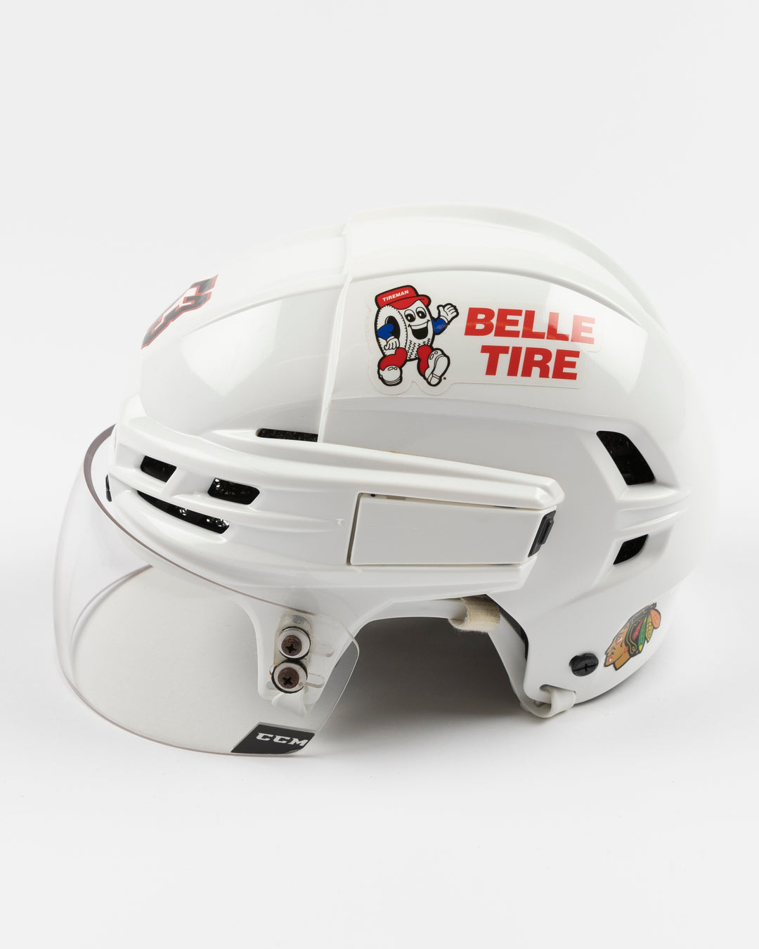 white CCM hockey helmet used by Chicago Blackhawks player Marcel Marcel - left side lay flat