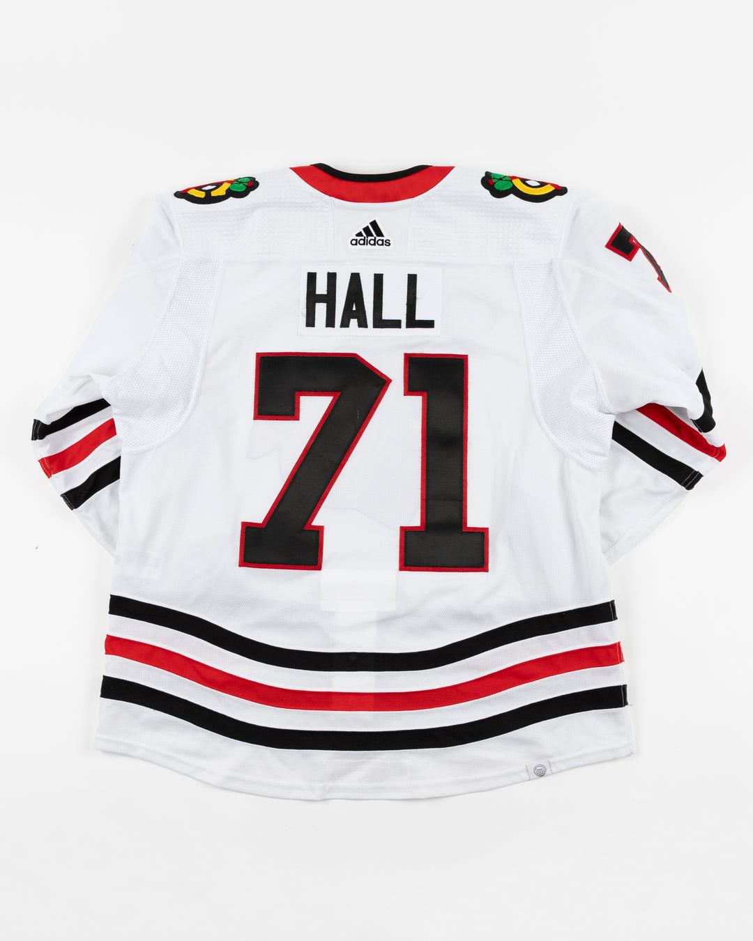 white adidas Chicago Blackhawks away jersey game used by Blackhawks player Taylor Hall - back lay flat