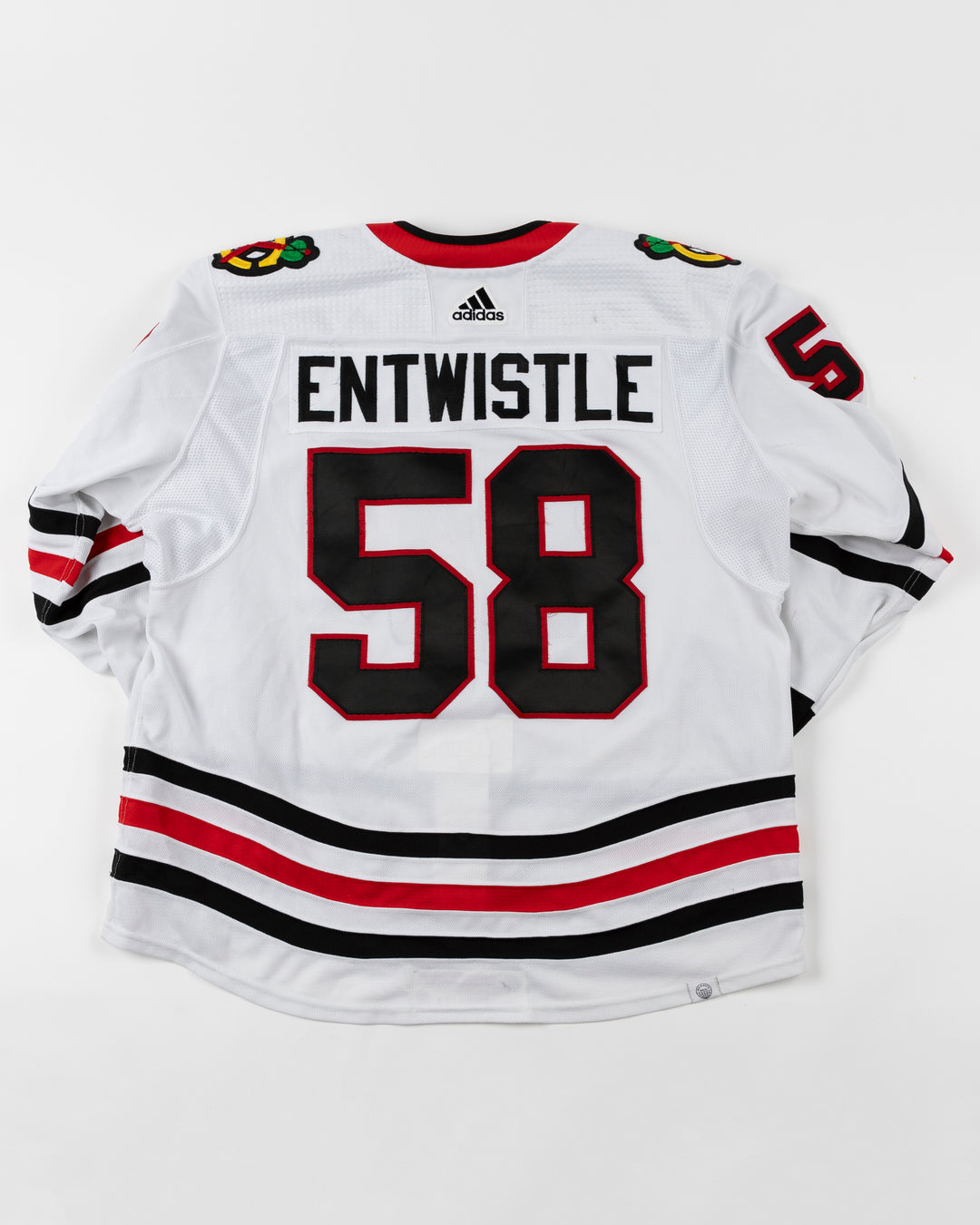 white adidas Chicago Blackhawks away jersey game used by Chicago Blackhawks player Mackenzie Entwistle - back lay flat