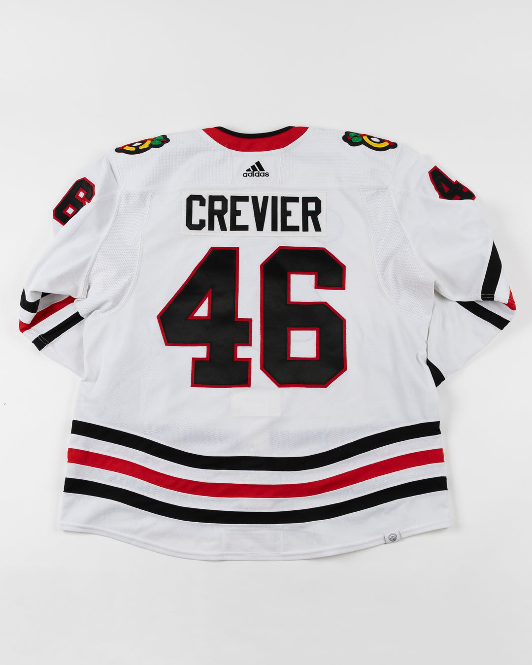 white adidas Chicago Blackhawks hockey jersey game used by Blackhawks player Louis Crevier - back lay flat