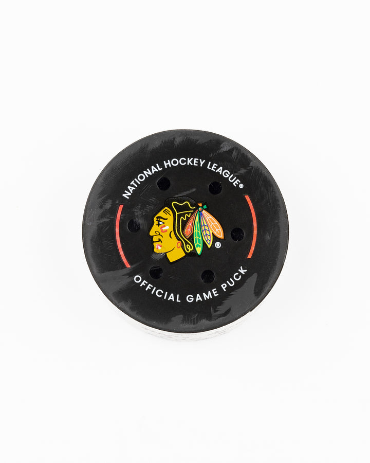 official Chicago Blackhawks game-used puck used against the Carolina Hurricanes on January 20, 2025 - front lay flat