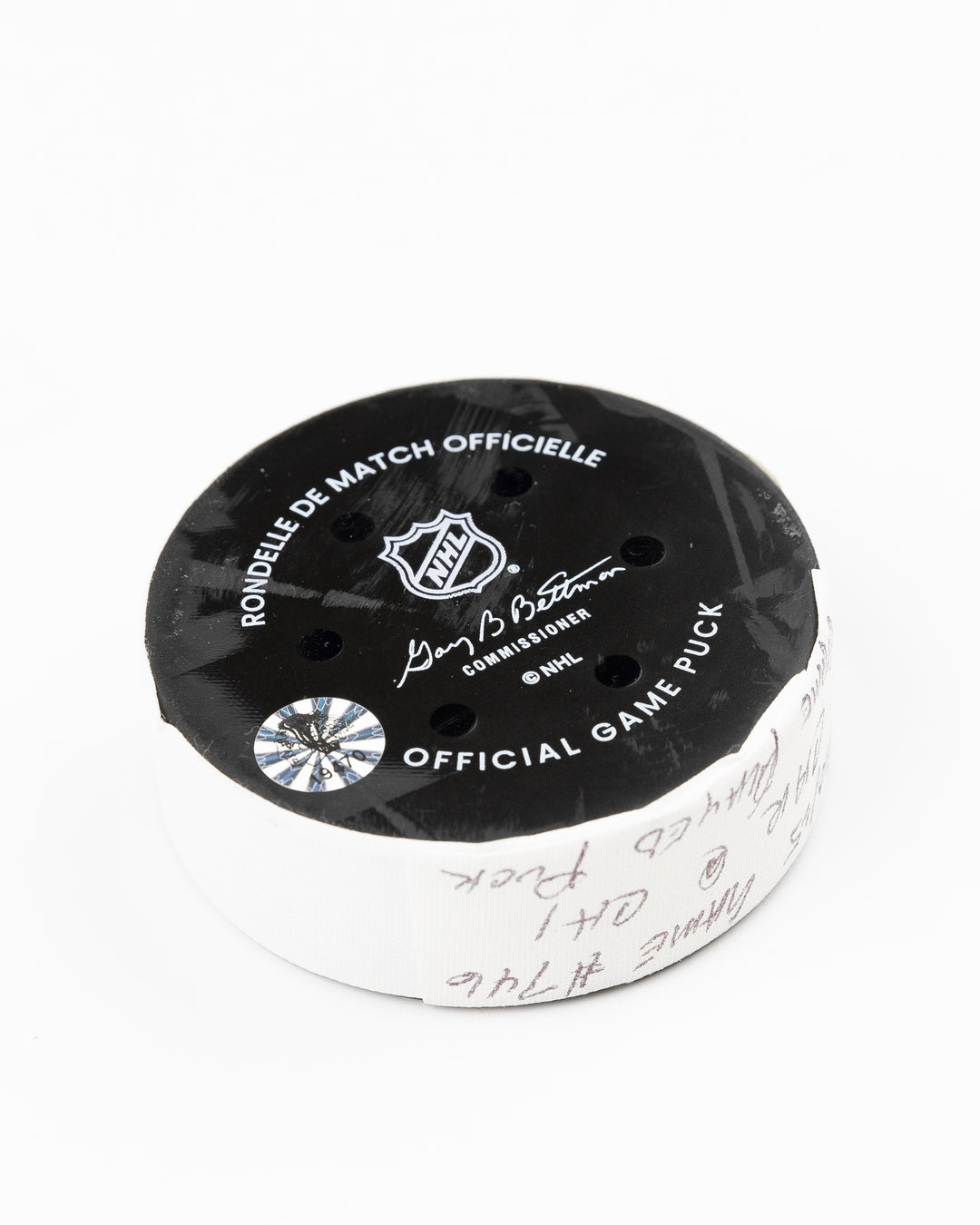 official Chicago Blackhawks game-used puck used against the Carolina Hurricanes on January 20, 2025 - back angle lay flat