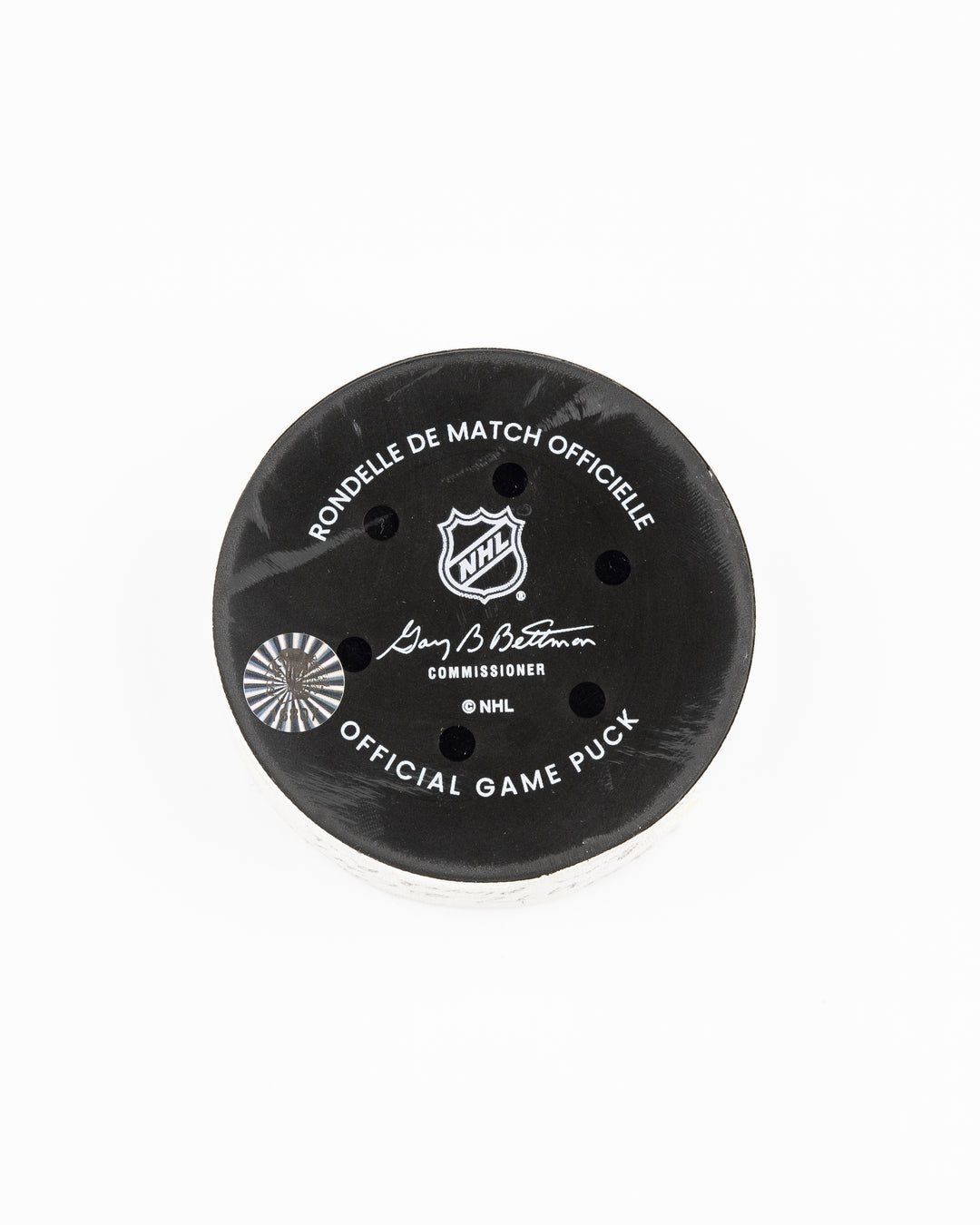 official Chicago Blackhawks game-used hockey puck used in the game against the Montreal Canadiens on January 3, 2025 - back lay flat