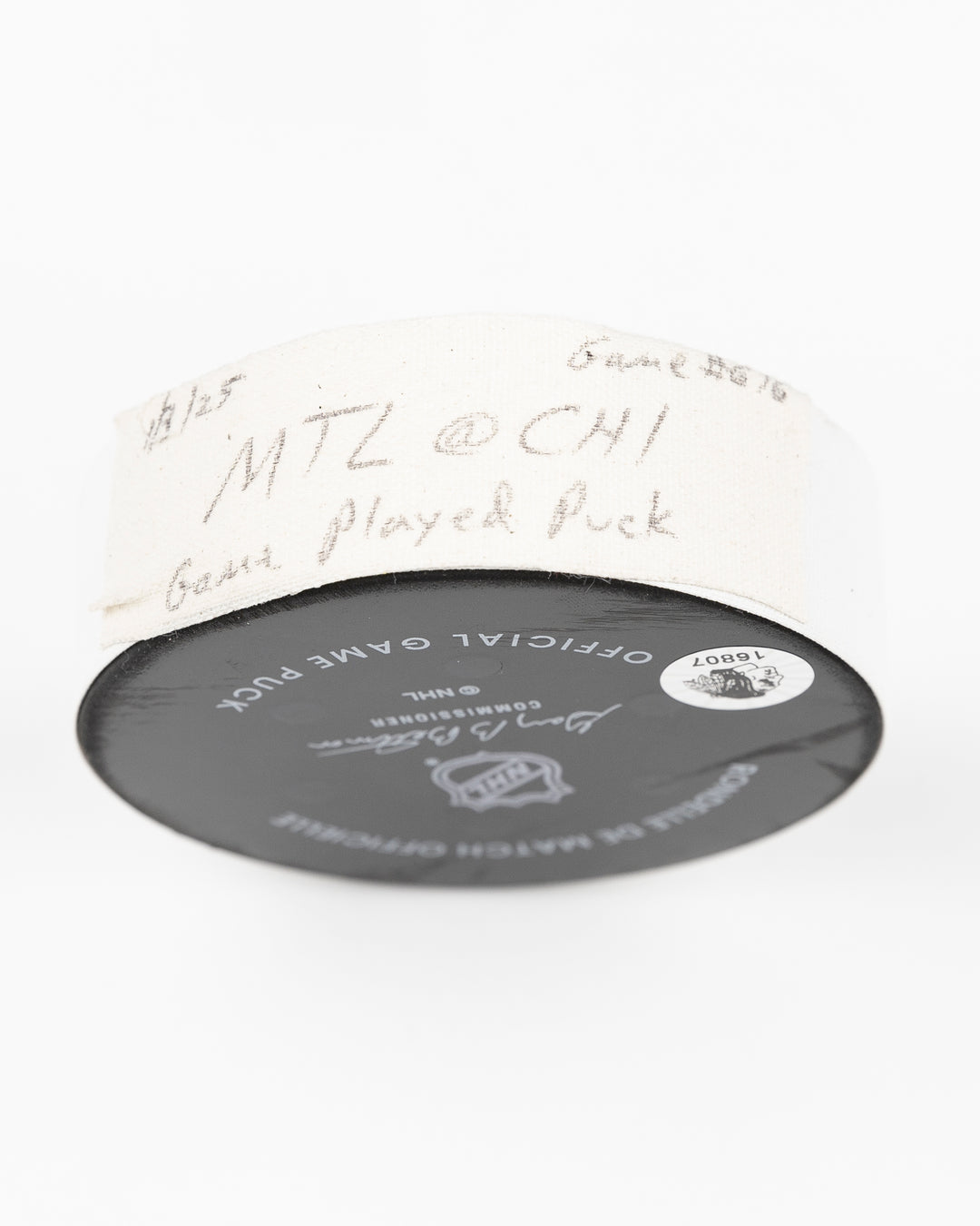 official Chicago Blackhawks game-used hockey puck used in the game against the Montreal Canadiens on January 3, 2025 - tape detail lay flat