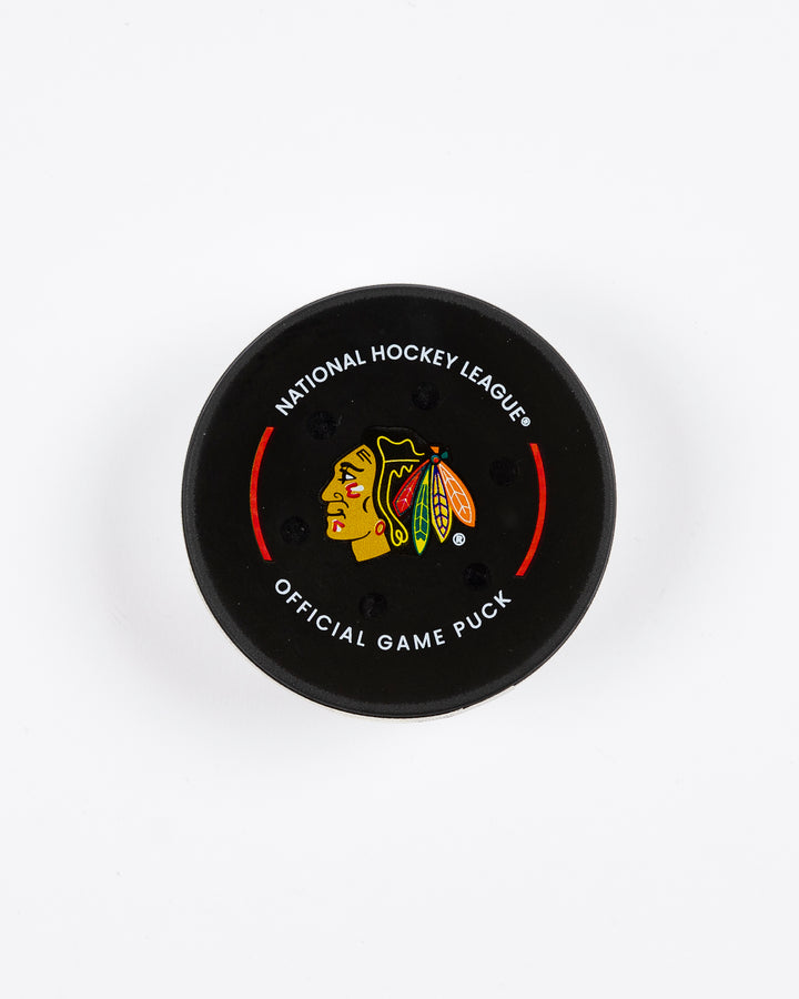 February 2025 official Chicago Blackhawks game-used hockey puck - front lay flat