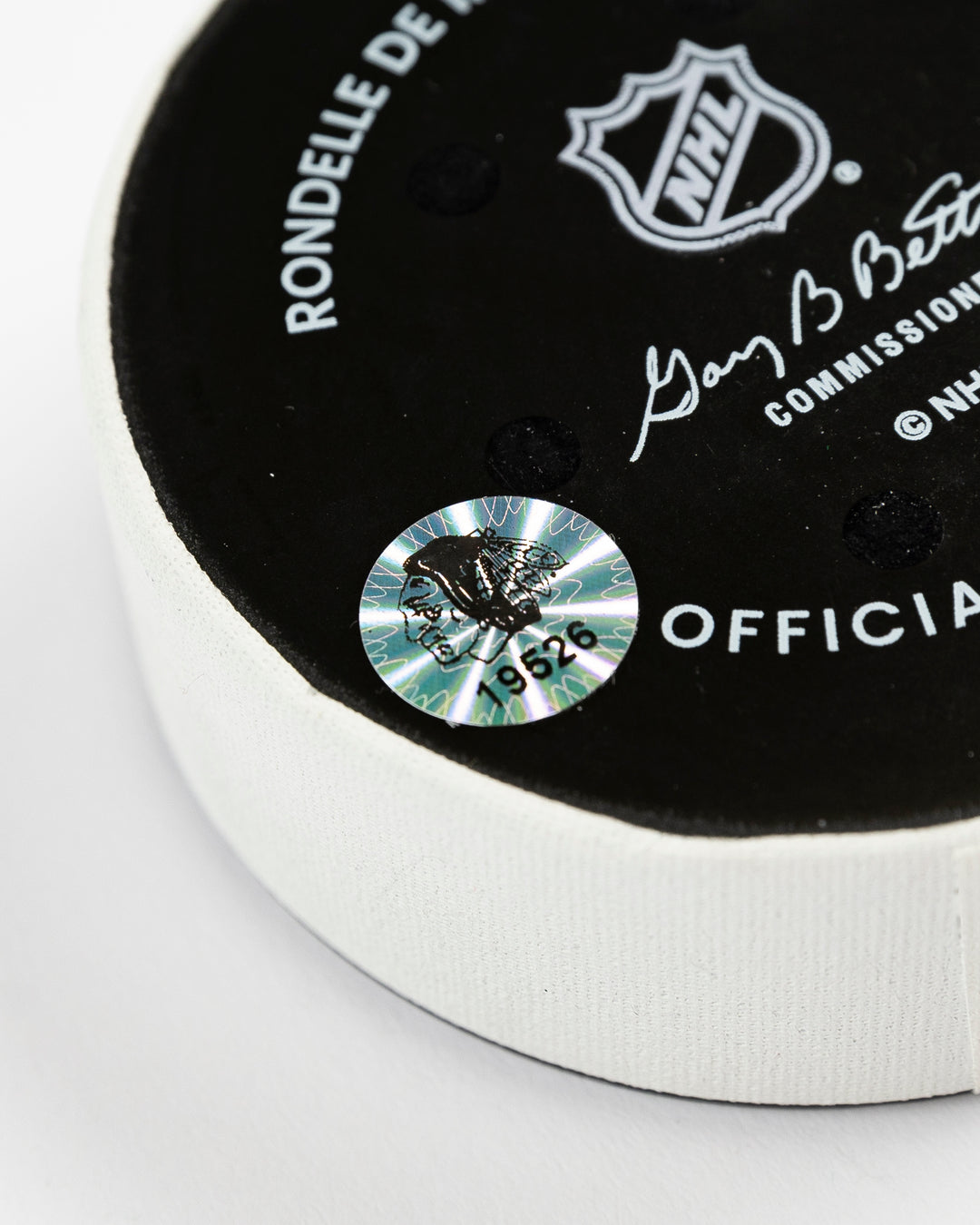 February 2025 official Chicago Blackhawks game-used hockey puck - hologram sticker detail lay flat