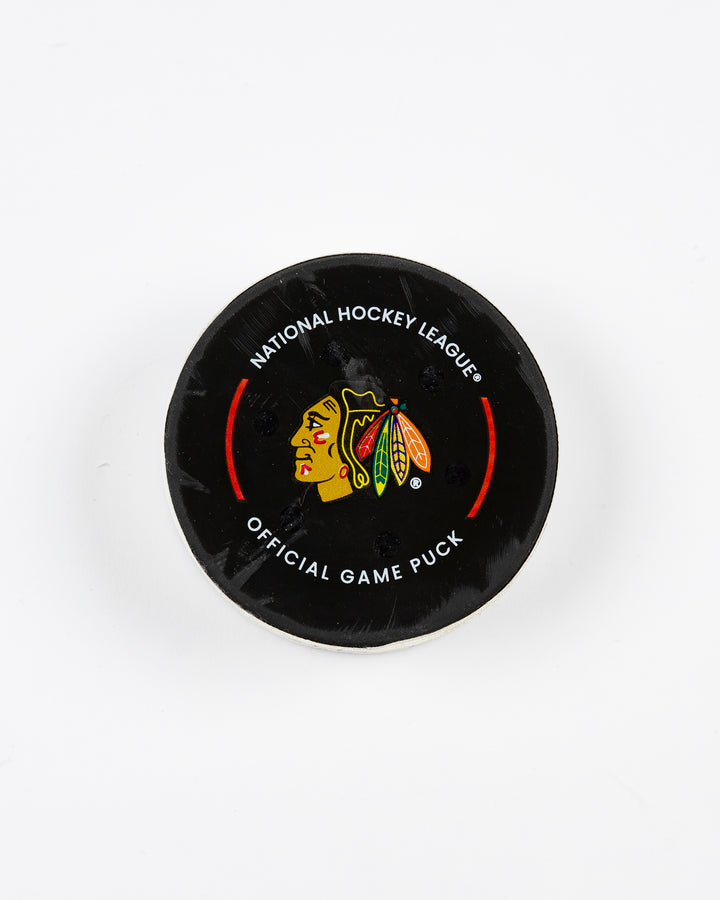 February 2025 official game-used Chicago Blackhawks hockey puck - front lay flat