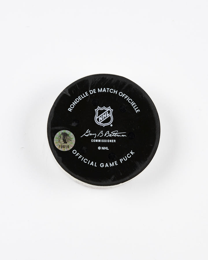 February 2025 official game-used Chicago Blackhawks hockey puck - back lay flat