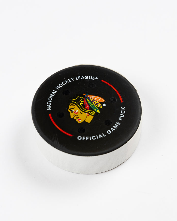 official Chicago Blackhawks game-used puck used in February of 2025 - front angle lay flat