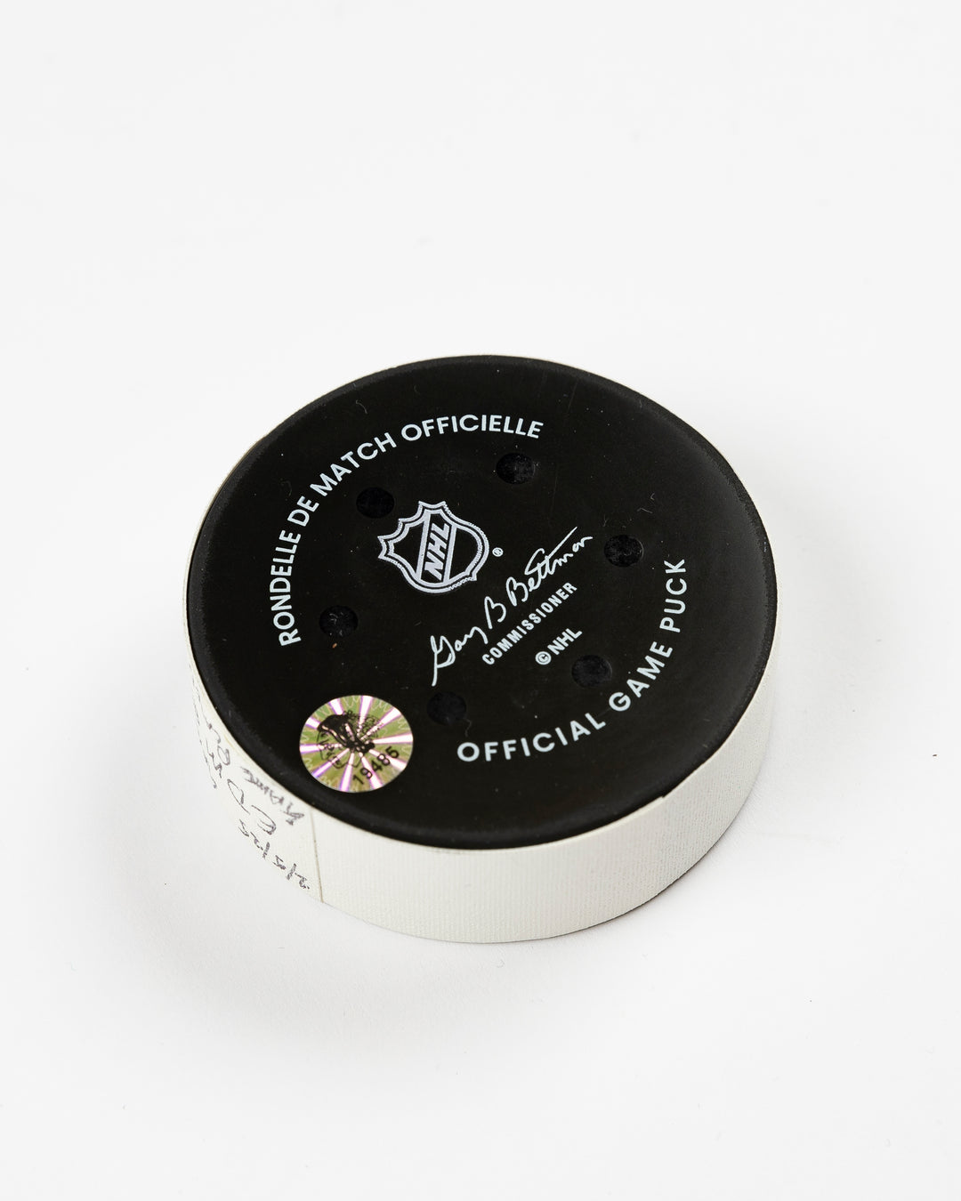 official Chicago Blackhawks game-used puck used in February of 2025 - back angle lay flat