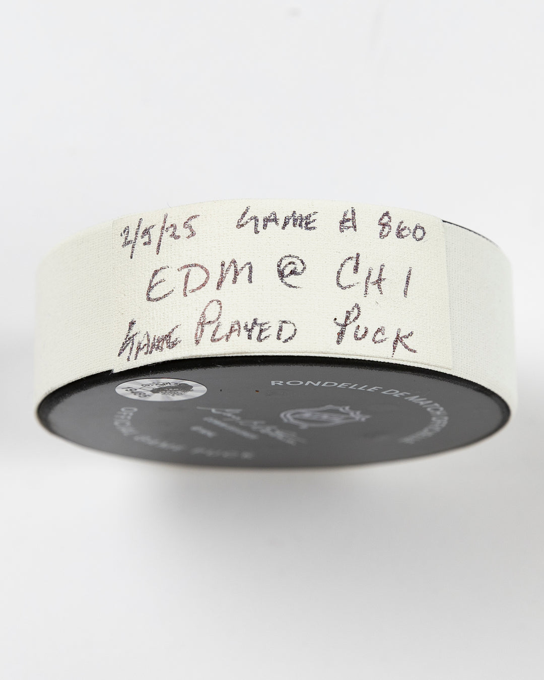 official Chicago Blackhawks game-used puck used in February of 2025 - tape detail lay flat