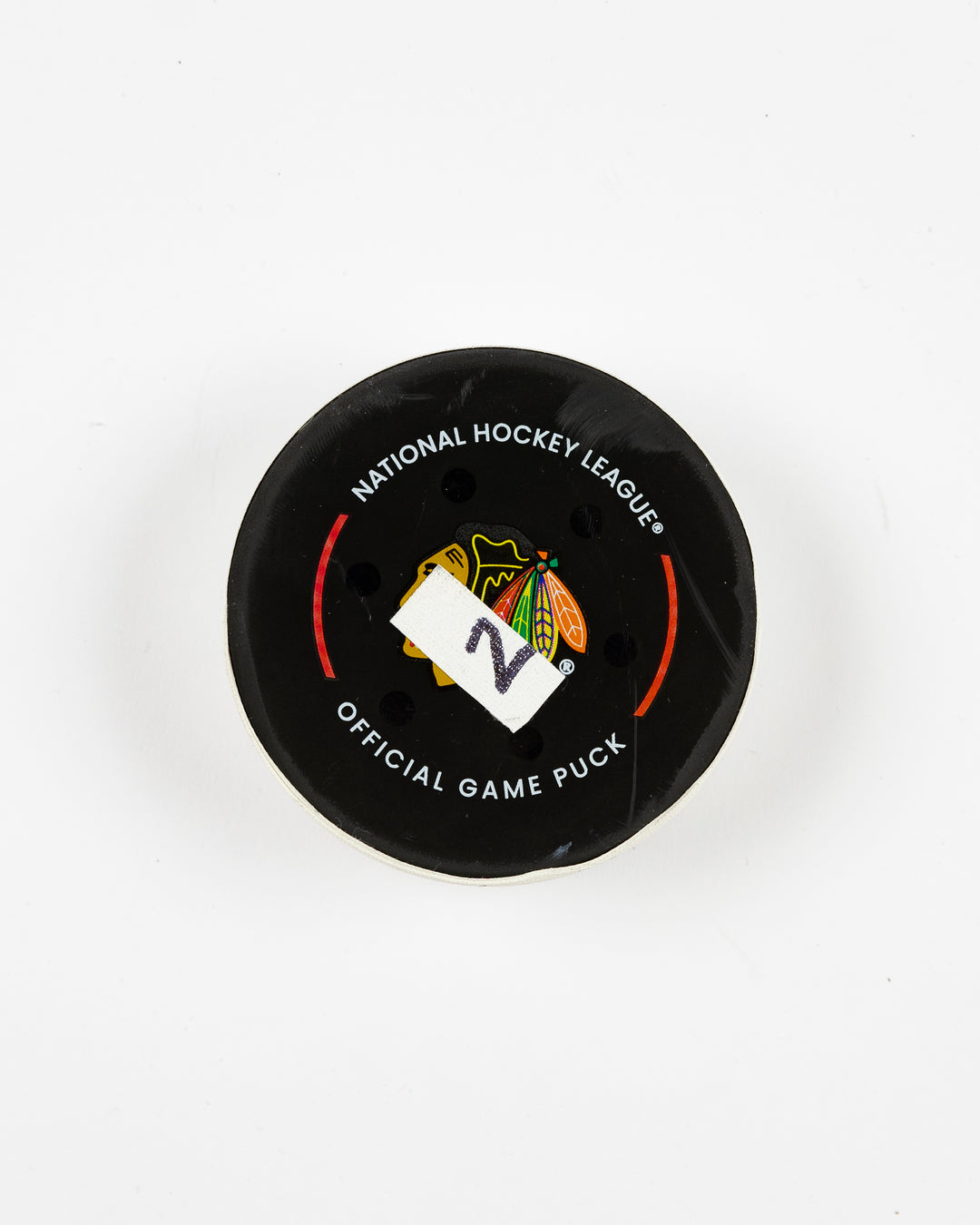 official Chicago Blackhawks game-used goal puck scored by Lukas Reichel on February 5, 2025 - front lay flat