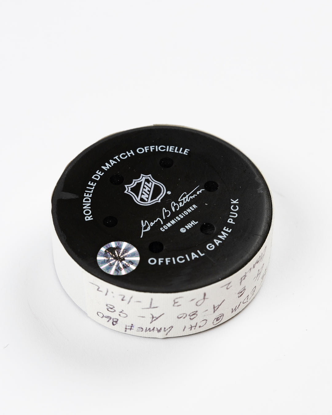 official Chicago Blackhawks game-used goal hockey puck scored by Ryan Donato against the Edmonton Oilers on February 5, 2025 - back angle lay flat