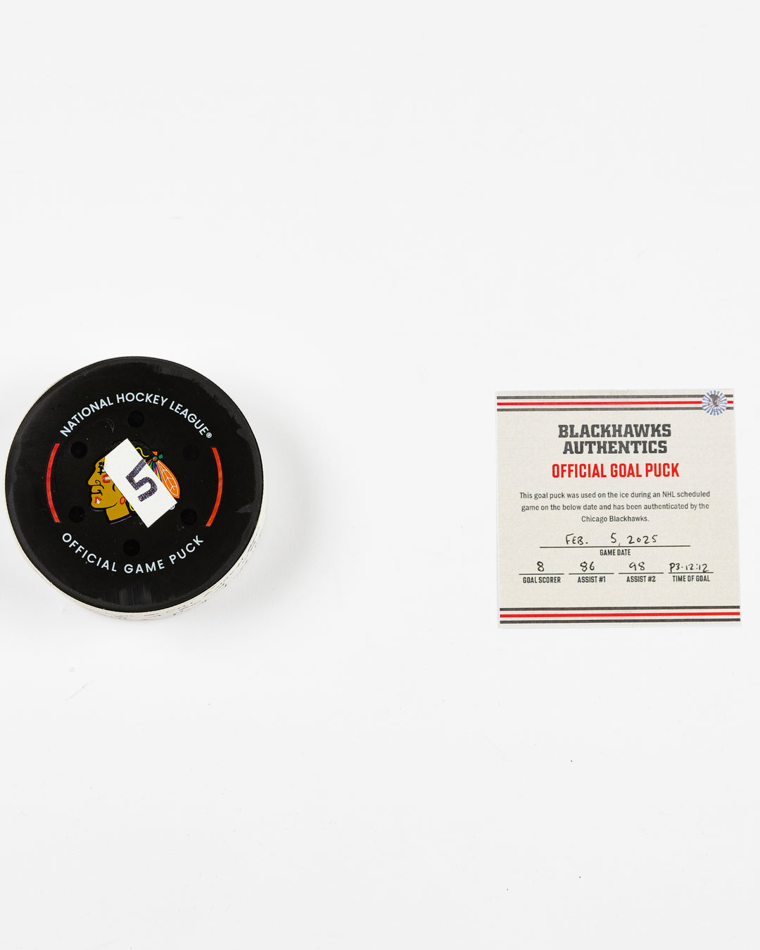 official Chicago Blackhawks game-used goal hockey puck scored by Ryan Donato against the Edmonton Oilers on February 5, 2025 - front lay flat of puck and certificate