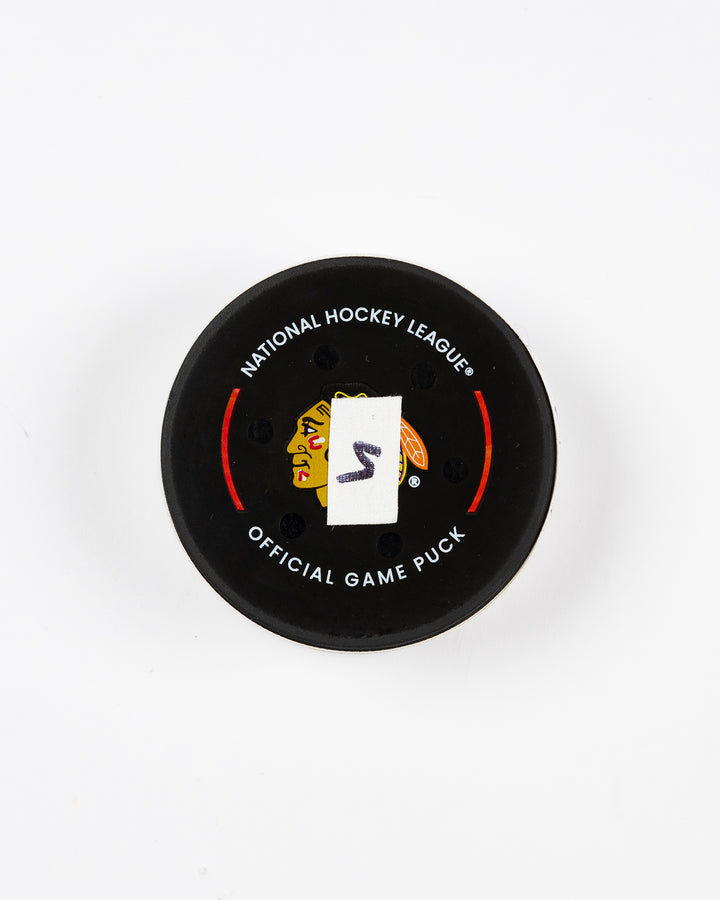 official Chicago Blackhawks game-used goal puck scored by Philipp Kurashev against the Toronto Maple Leaves on February 23, 2025 - front lay flat