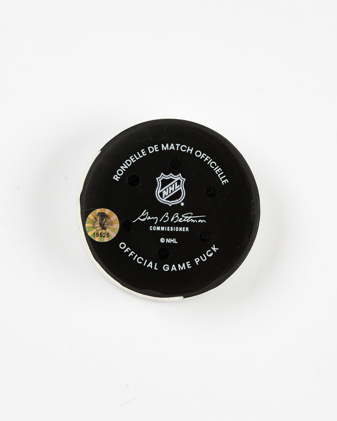 official Chicago Blackhawks game-used goal puck scored by Philipp Kurashev against the Toronto Maple Leaves on February 23, 2025 - back lay flat