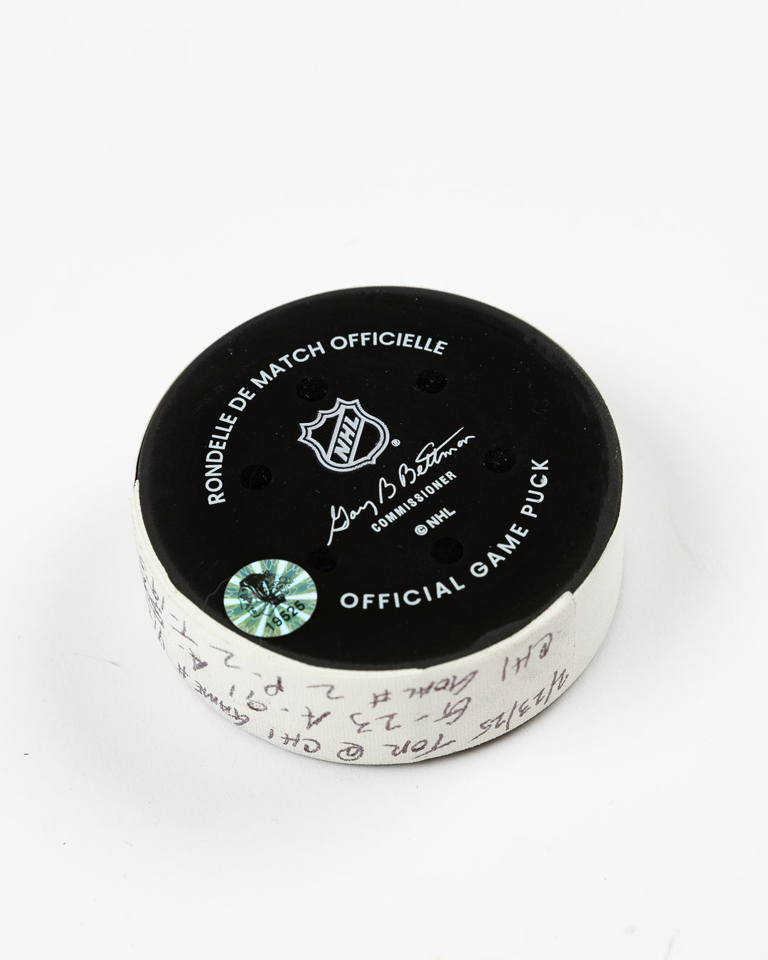 official Chicago Blackhawks game-used goal puck scored by Philipp Kurashev against the Toronto Maple Leaves on February 23, 2025 - back angle lay flat