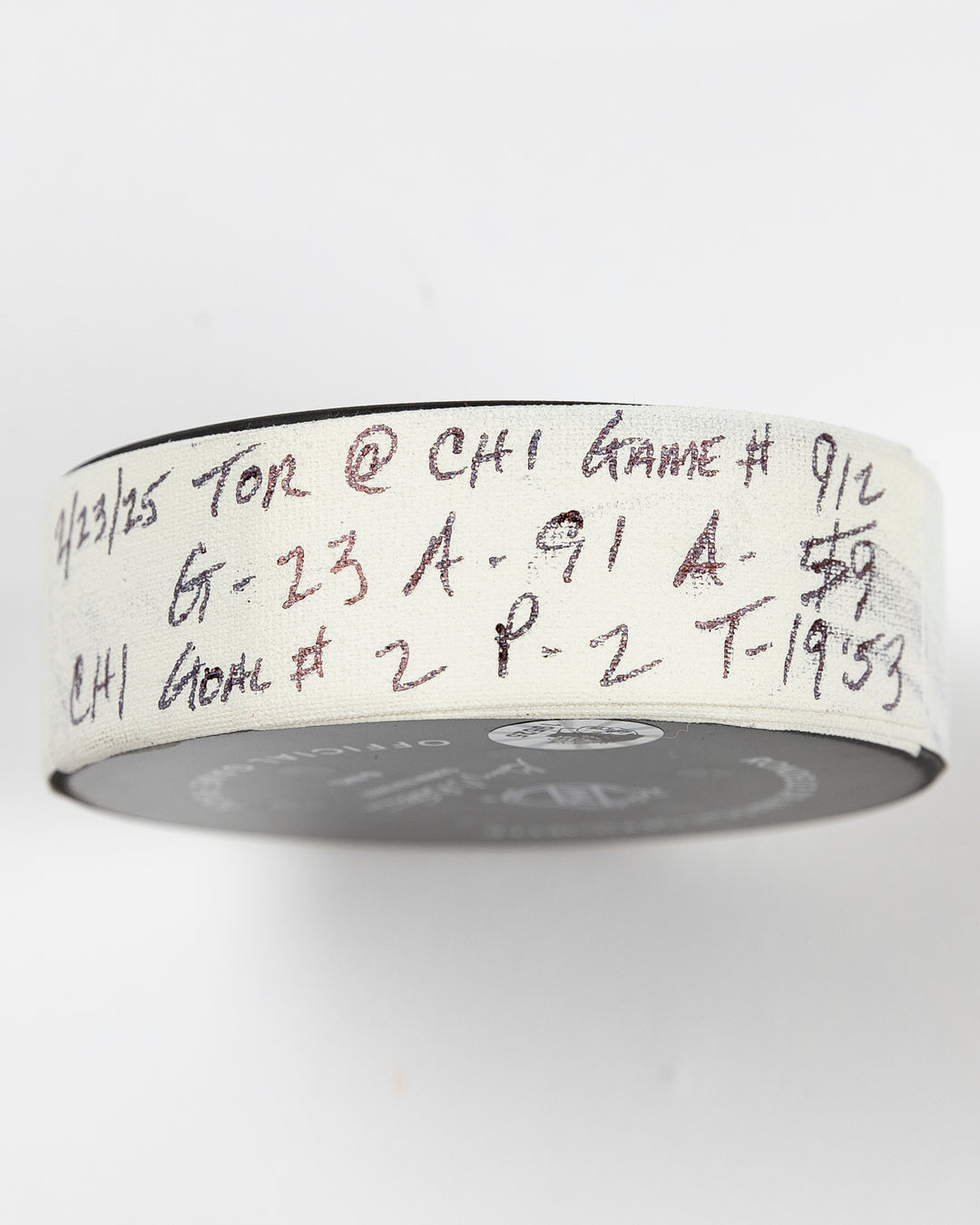 official Chicago Blackhawks game-used goal puck scored by Philipp Kurashev against the Toronto Maple Leaves on February 23, 2025 - tape detail lay flat