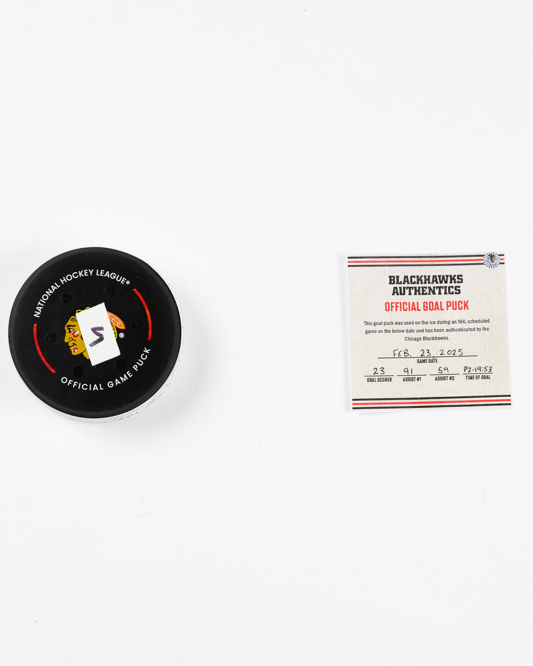 official Chicago Blackhawks game-used goal puck scored by Philipp Kurashev against the Toronto Maple Leaves on February 23, 2025 - front lay flat puck and certificate