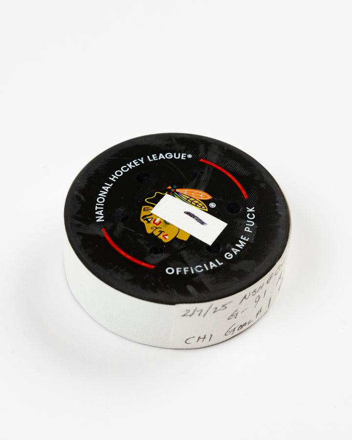 official Chicago Blackhawks game-used goal puck scored by Frank Nazar on February 7, 2025 against Nashville Predators - front angle lay flat