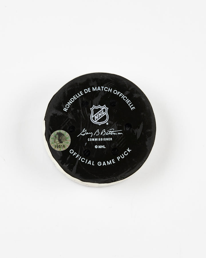 official Chicago Blackhawks game-used goal puck scored by Frank Nazar on February 7, 2025 against Nashville Predators - back lay flat