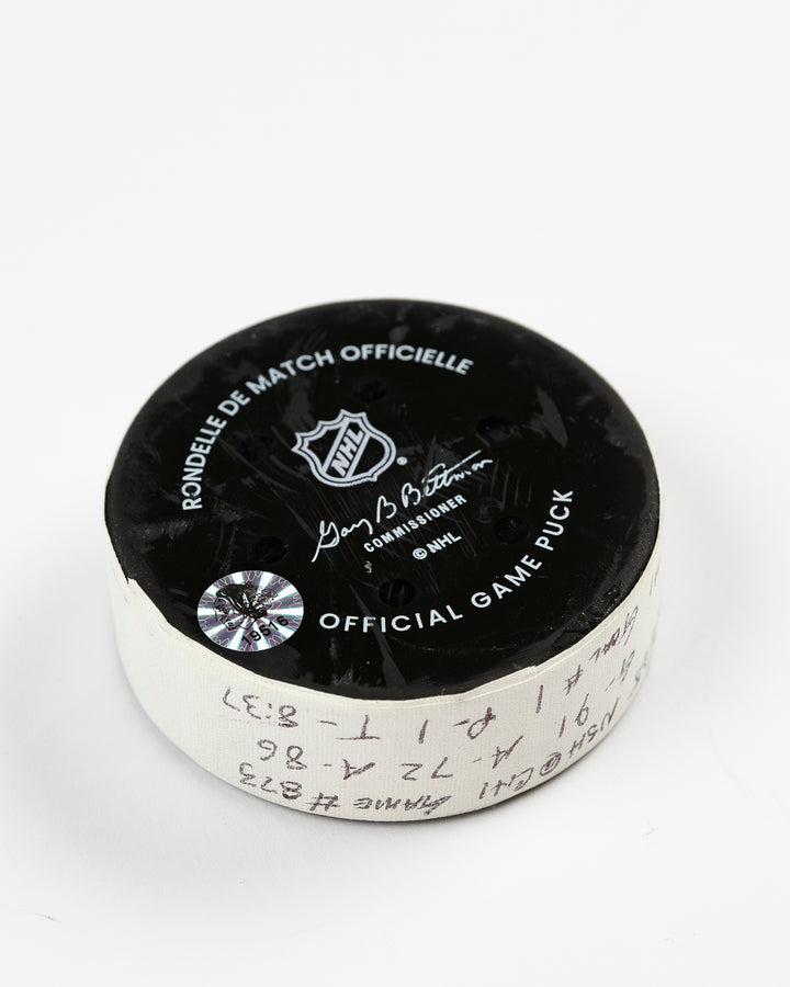 official Chicago Blackhawks game-used goal puck scored by Frank Nazar on February 7, 2025 against Nashville Predators - back angle lay flat