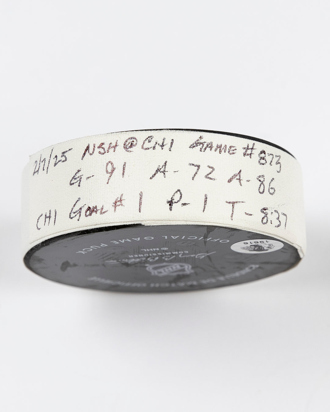 official Chicago Blackhawks game-used goal puck scored by Frank Nazar on February 7, 2025 against Nashville Predators - tape detail lay flat