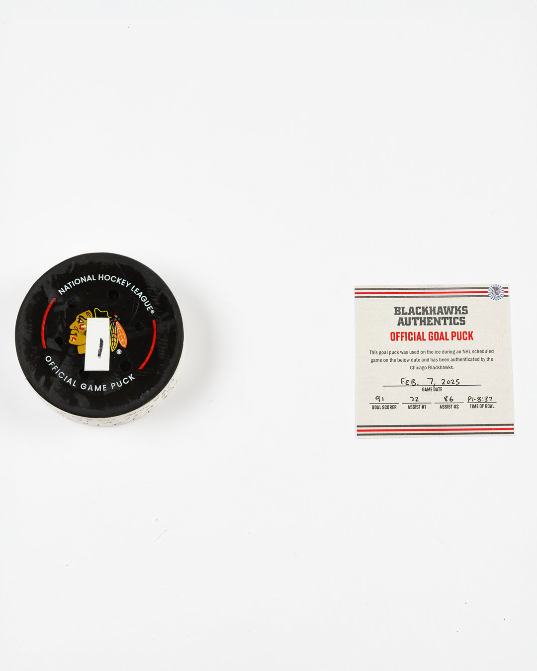 official Chicago Blackhawks game-used goal puck scored by Frank Nazar on February 7, 2025 against Nashville Predators - front lay flat of puck and certificate