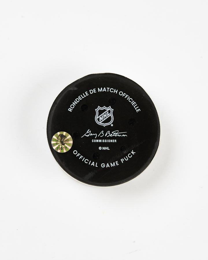 official Chicago Blackhawks game-used goal puck scored by Pat Maroon on February 7, 2025 against the Edmonton Oilers - back lay flat