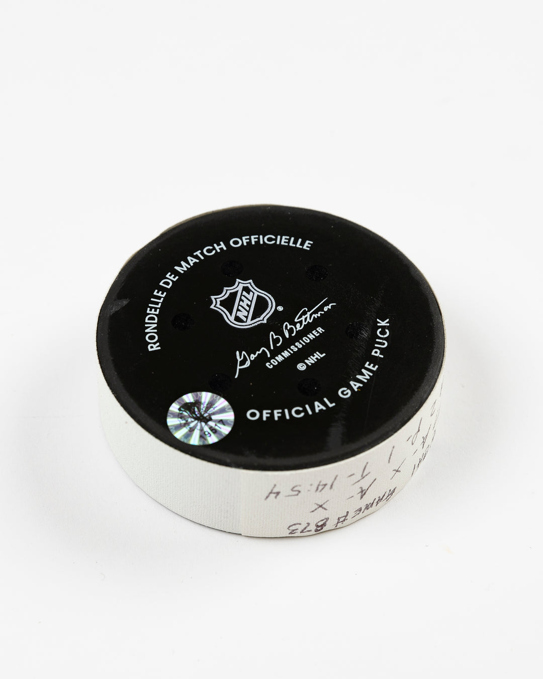 official Chicago Blackhawks game-used goal puck scored by Pat Maroon on February 7, 2025 against the Edmonton Oilers - back angle lay flat