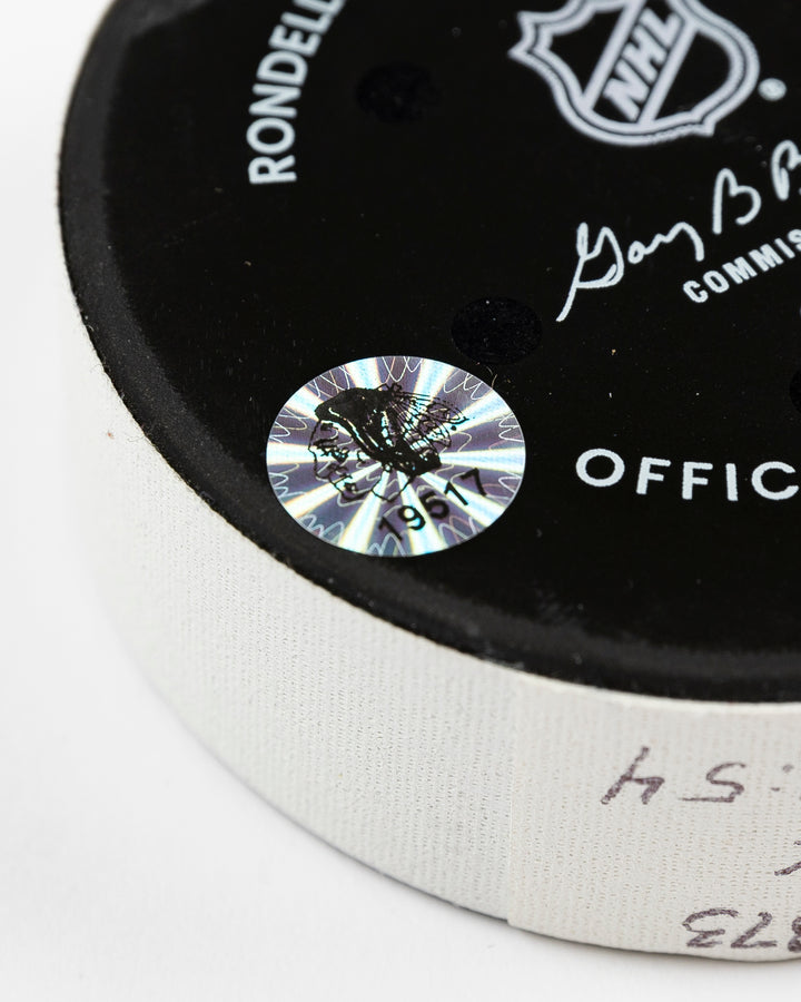 official Chicago Blackhawks game-used goal puck scored by Pat Maroon on February 7, 2025 against the Edmonton Oilers - hologram sticker detail lay flat