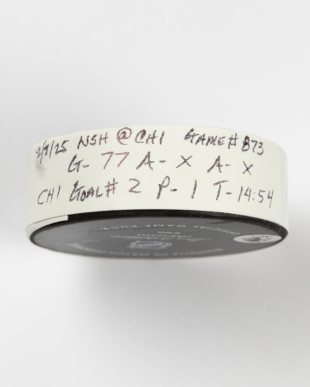 official Chicago Blackhawks game-used goal puck scored by Pat Maroon on February 7, 2025 against the Edmonton Oilers - tape detail lay flat