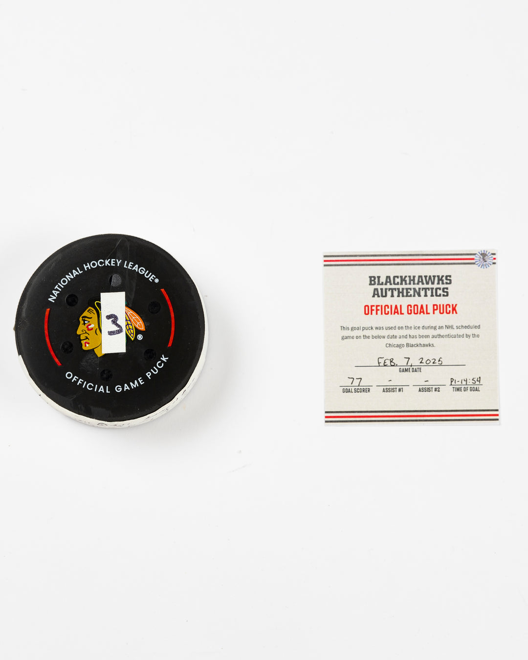 official Chicago Blackhawks game-used goal puck scored by Pat Maroon on February 7, 2025 against the Edmonton Oilers - front lay flat of puck and certificate