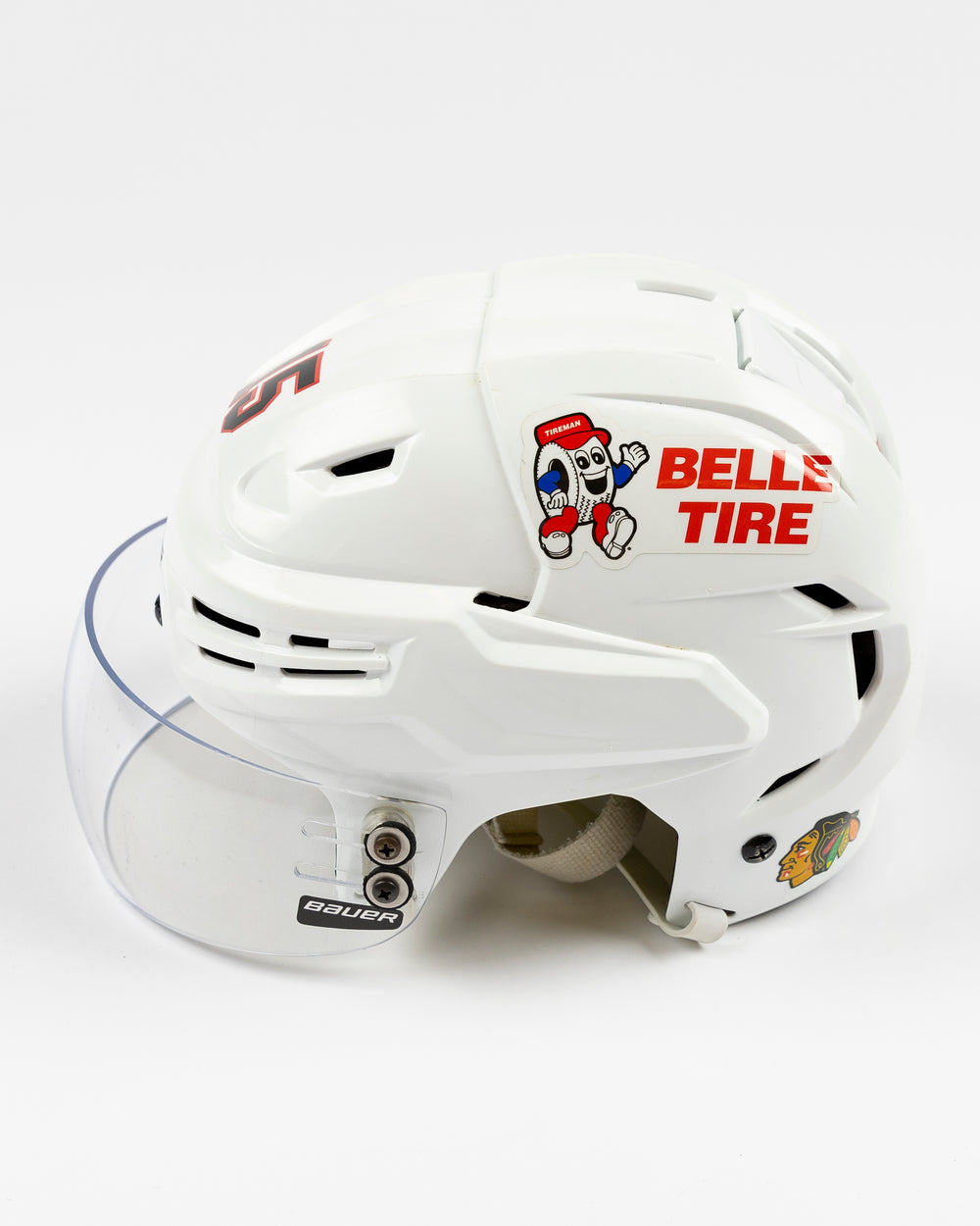 white Bauer hockey helmet used by Chicago Blackhawks player Craig Smith - left side lay flat