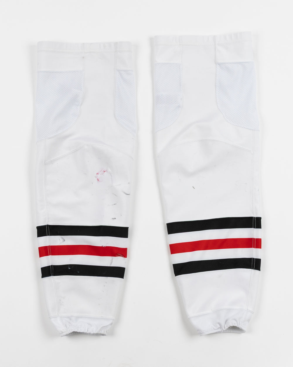 white adidas hockey socks used by Chicago Blackhawks goalie Petr Mrazek - back lay flat