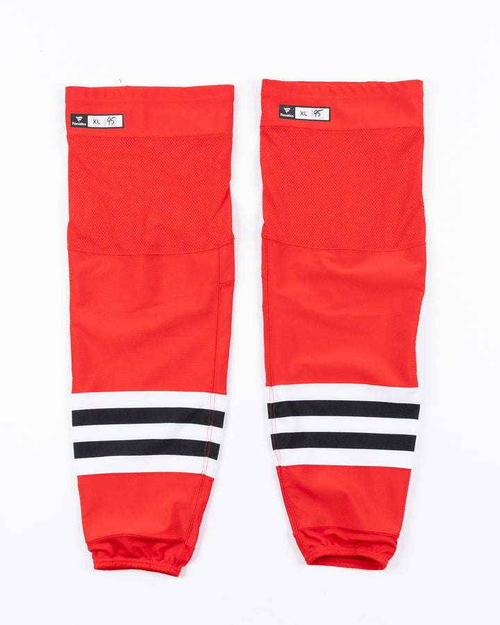 red adidas hockey socks used by Chicago Blackhawks player Ilya Mikheyev - front lay flat