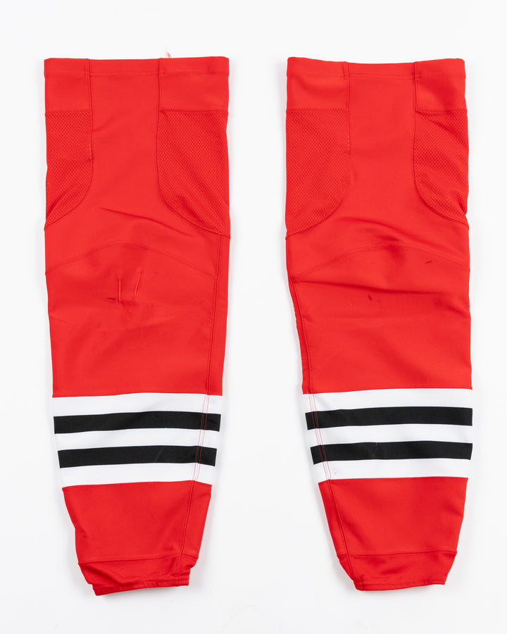 red adidas hockey socks used by Chicago Blackhawks player Ilya Mikheyev - back lay flat