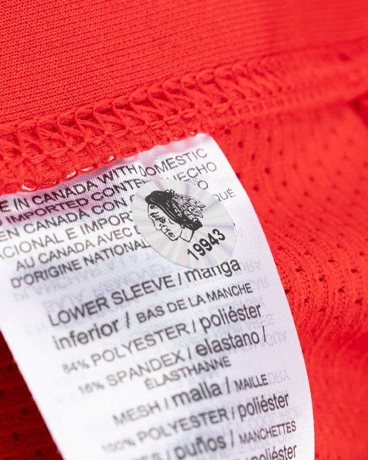 red adidas hockey socks used by Chicago Blackhawks player Ilya Mikheyev - hologram sticker detail lay flat