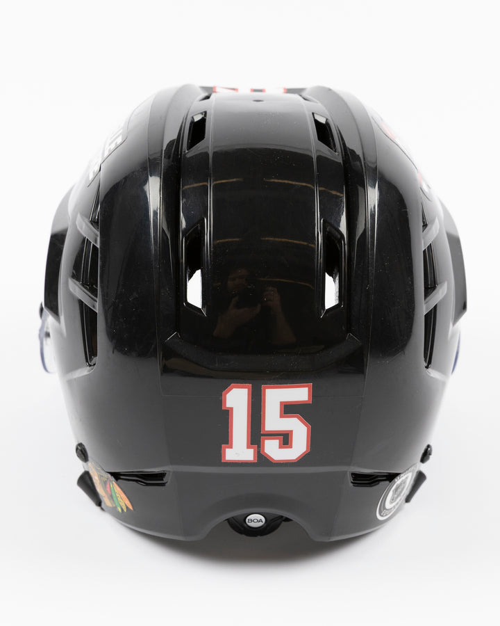 black Warrior brand hockey helmet used by Chicago Blackhawks player Joey Anderson - back lay flat