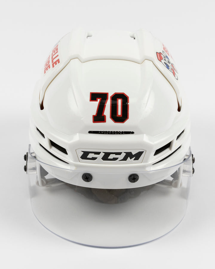 white CCM hockey helmet worn and used by Chicago Blackhawks player Cole Guttman - front lay flat