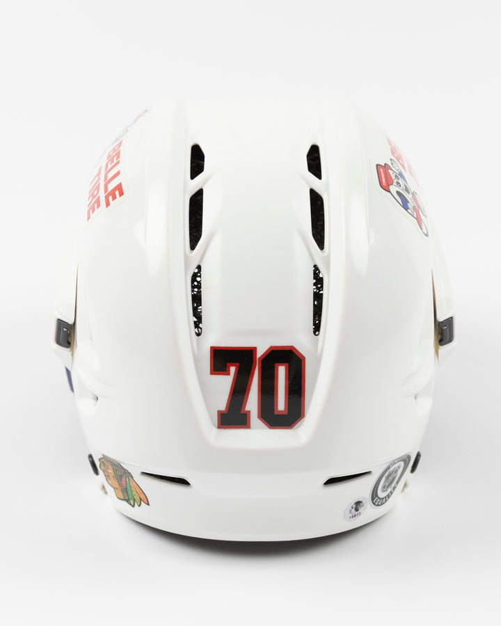 white CCM hockey helmet worn and used by Chicago Blackhawks player Cole Guttman - back lay flat