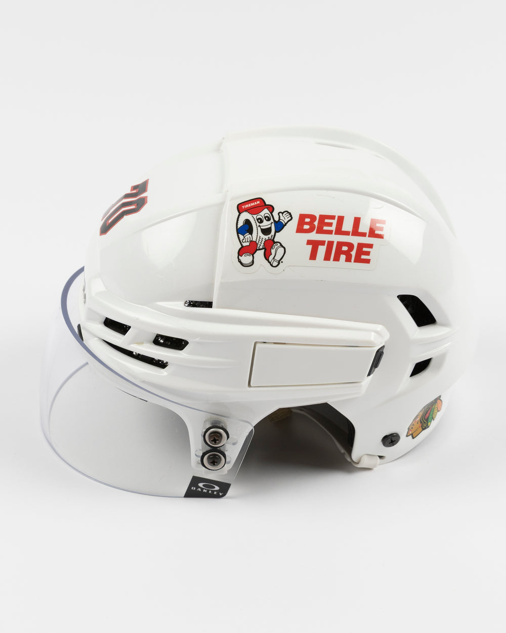 white CCM hockey helmet worn and used by Chicago Blackhawks player Cole Guttman - left side lay flat