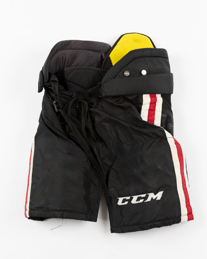 black CCM hockey pants used by Chicago Blackhawks player Wyatt Kaiser - front lay flat