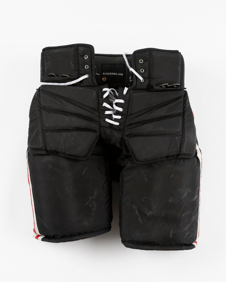 black Vaugh hockey pants used by Chicago Blackhawks goalie Arvid Soderblom - front lay flat