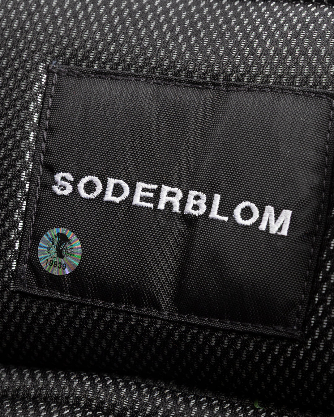 black Vaugh hockey pants used by Chicago Blackhawks goalie Arvid Soderblom - name detail lay flat