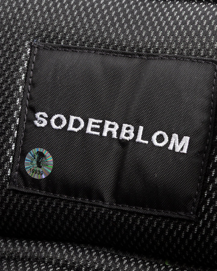 black Vaugh hockey pants used by Chicago Blackhawks goalie Arvid Soderblom - name detail lay flat
