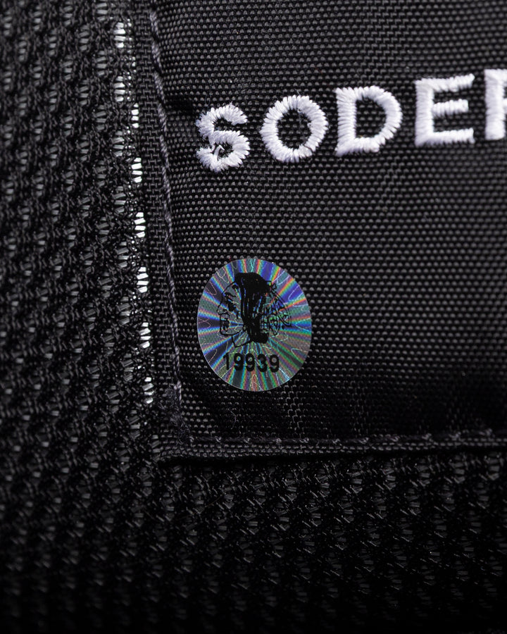 black Vaugh hockey pants used by Chicago Blackhawks goalie Arvid Soderblom - hologram sticker detail lay flat