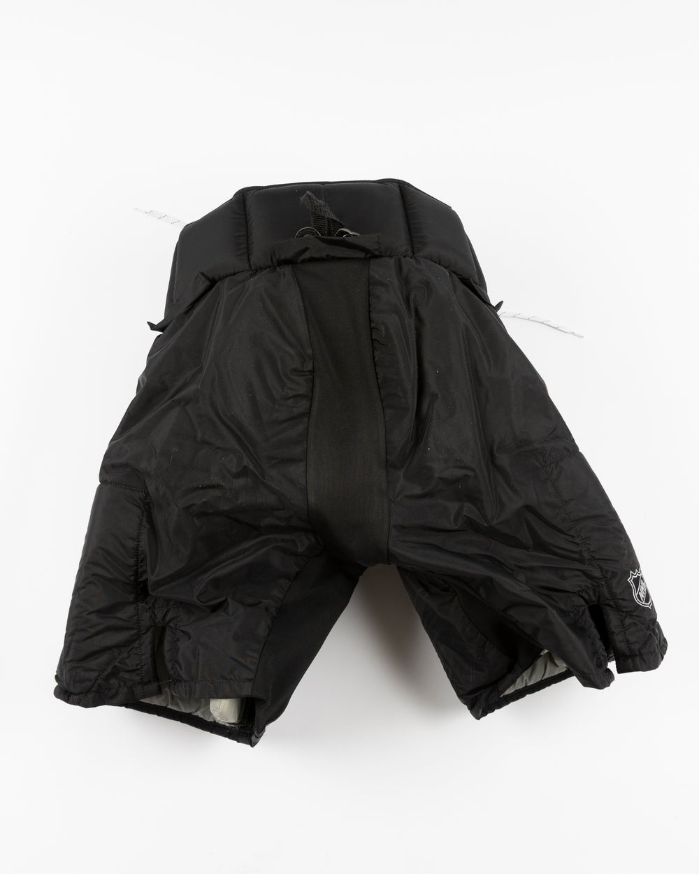 black Vaugh hockey pants used by Chicago Blackhawks goalie Arvid Soderblom - back lay flat