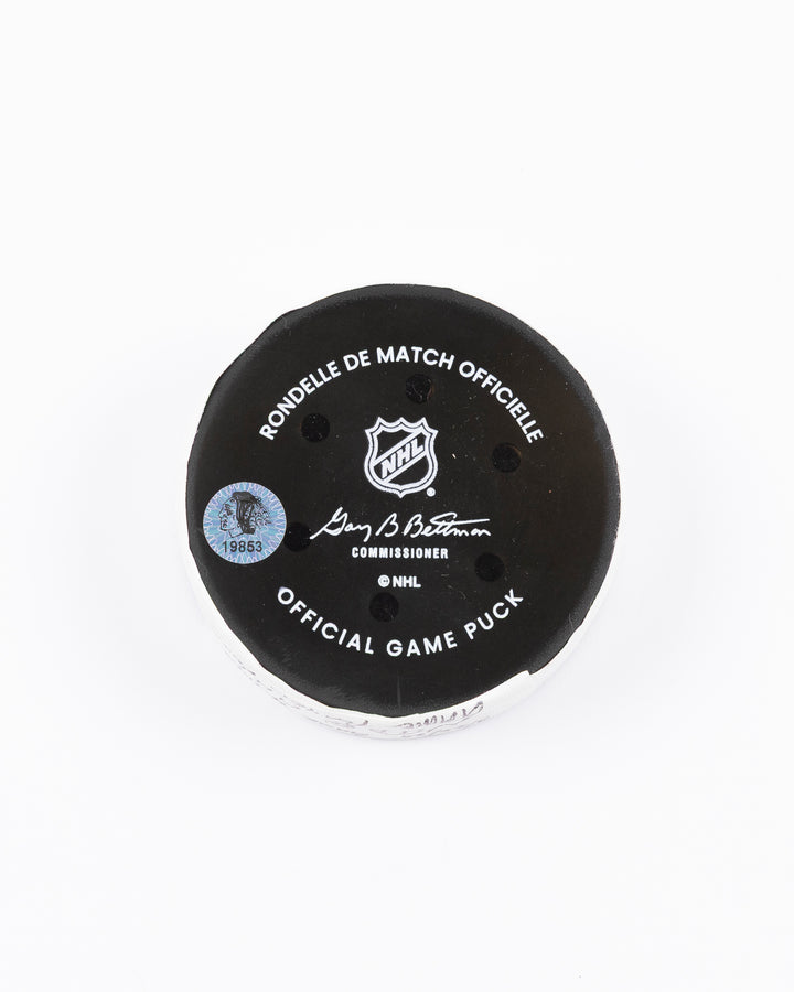 official Chicago Blackhawks hockey puck used in game against the New Jersey Devils on 3/26/25 - back lay flat